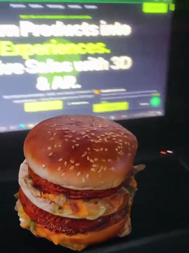 Photoreal 3D burger model rendered in augmented reality on a desk